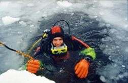 Picture of Christopher Pala scuba diving under the ice of the north pole.