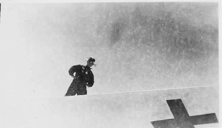 Japanese pilot stands on Betty Bomber Wing, Surrender of Japanese on the island of Ie Shima