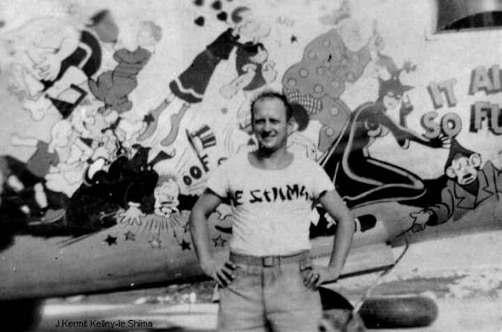 this is kermit kelley next to a b24 liberator on Ie Shima in WW2.