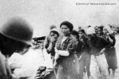 Islanders Standing on the Island of Ie Shima in WW2