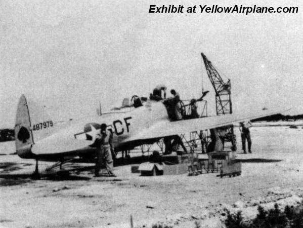 A P-47 Thunderbolt is being worked on on the island of Ie Shima in WW2