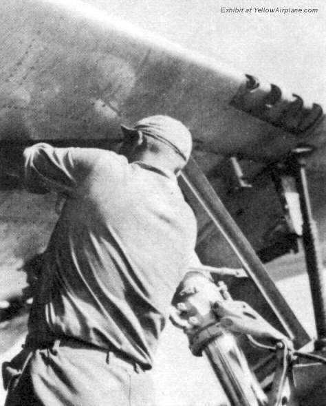 P-47 Thunderbolt Fighter Plane from WW2 undergoing maintenance on the main landing gear.