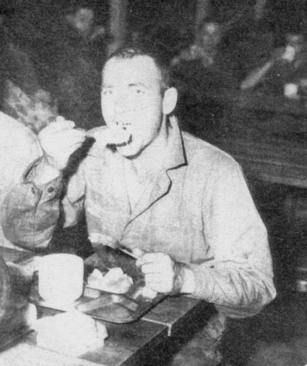 Photo of soldier eating chow at Bluethenthal USAAF Field, North Carolina.
