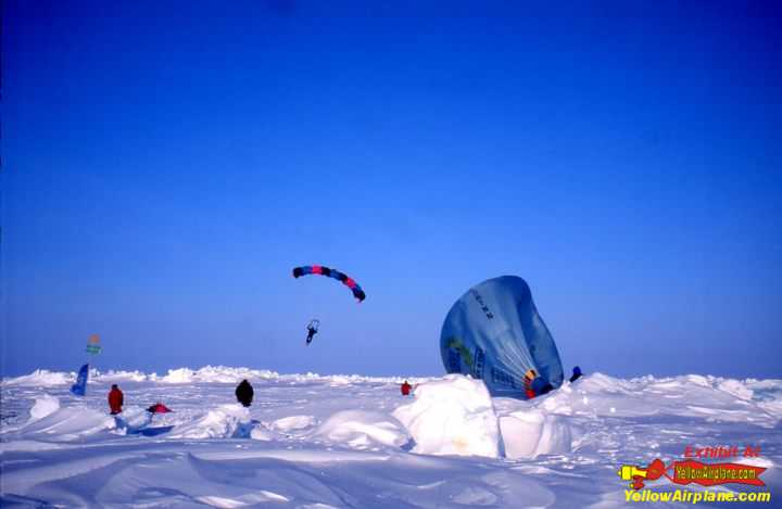 Parachutes land and a balloon takes off from the Geographic North Pole.