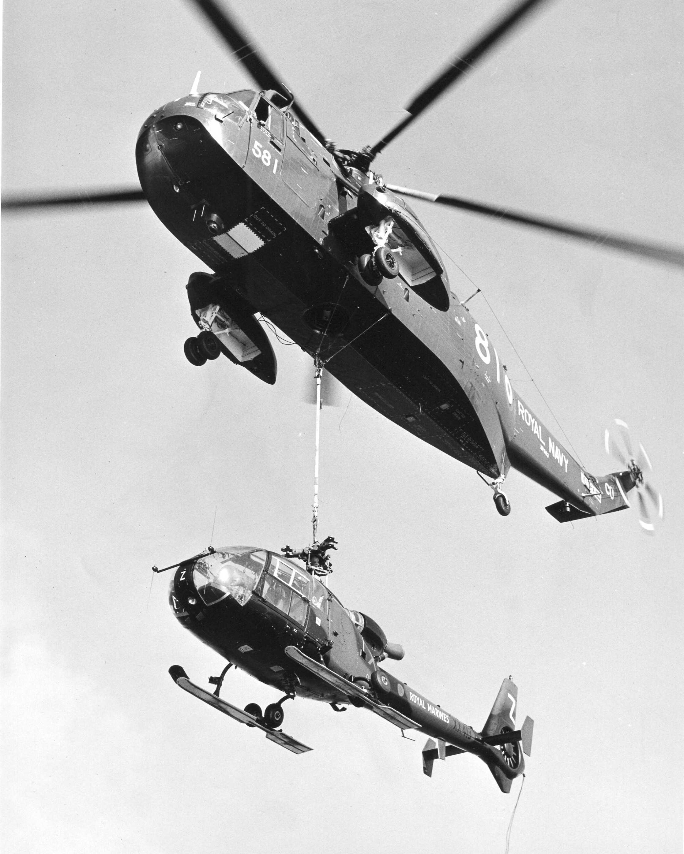 A Royal Navy Helicopter carrying a Royal Marines Helicopter