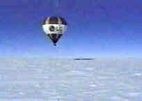 hot air balloon raises above the ice.