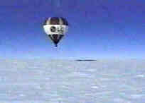 hot air balloon raises above the ice.