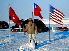 Standing on the north pole at Camp Borneo
