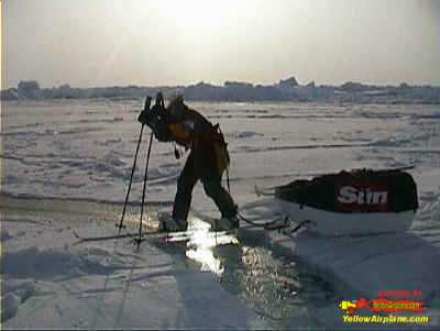 On a Ski Trip, a North Pole skier crosses a lead