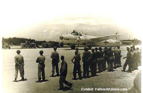 Japanese Surrender, Betty Bomber taxis as American Soldiers Line the Runway, WW2