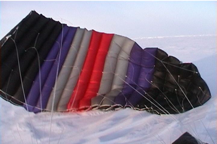 Beautiful color parachute picture of skydiver landing on the North Pole.