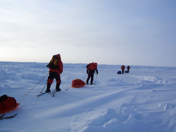 Cross Country Skiers pull their sledges to the their new horizon