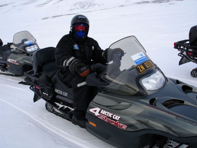 Randall Peeters at the controls of an Arctic Cat Snowmobile.
