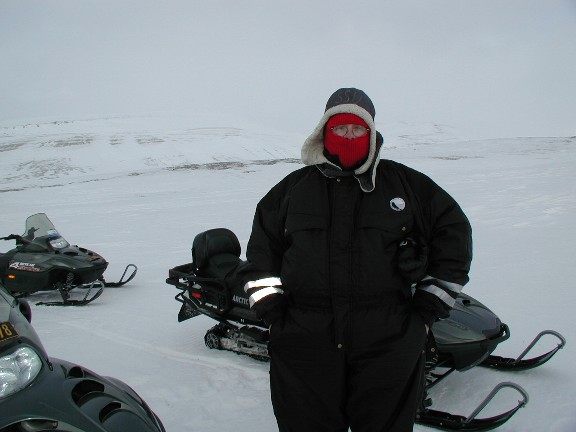 Snowmobile Pic of Richard Shultz in front of his snowmobile.