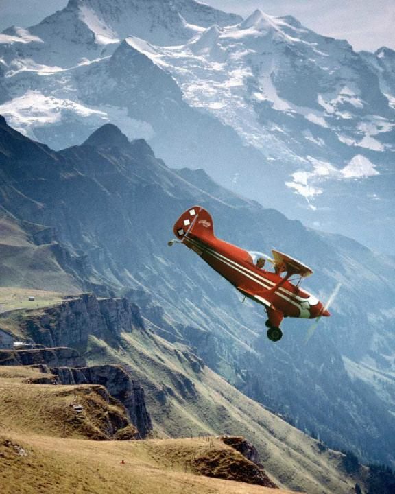 Photo of a Pitts S1S Flying over the High Sierra Nevada Mountains.