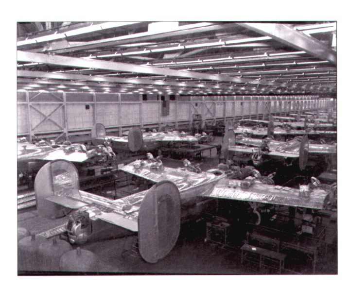 Assembly line of the willow run plant showing the b24 liberator in production