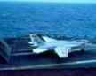 taken by the webmaster, an f14 tomcat goes to full afterburner on the deck of the uss kitty hawk