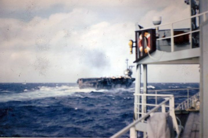 In 1967 the British Oiler, RFA Tidesurge (A98), photographs the USS Forrestall after the fire