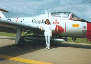 Weiquin standing near a Canadian Jet Trainer